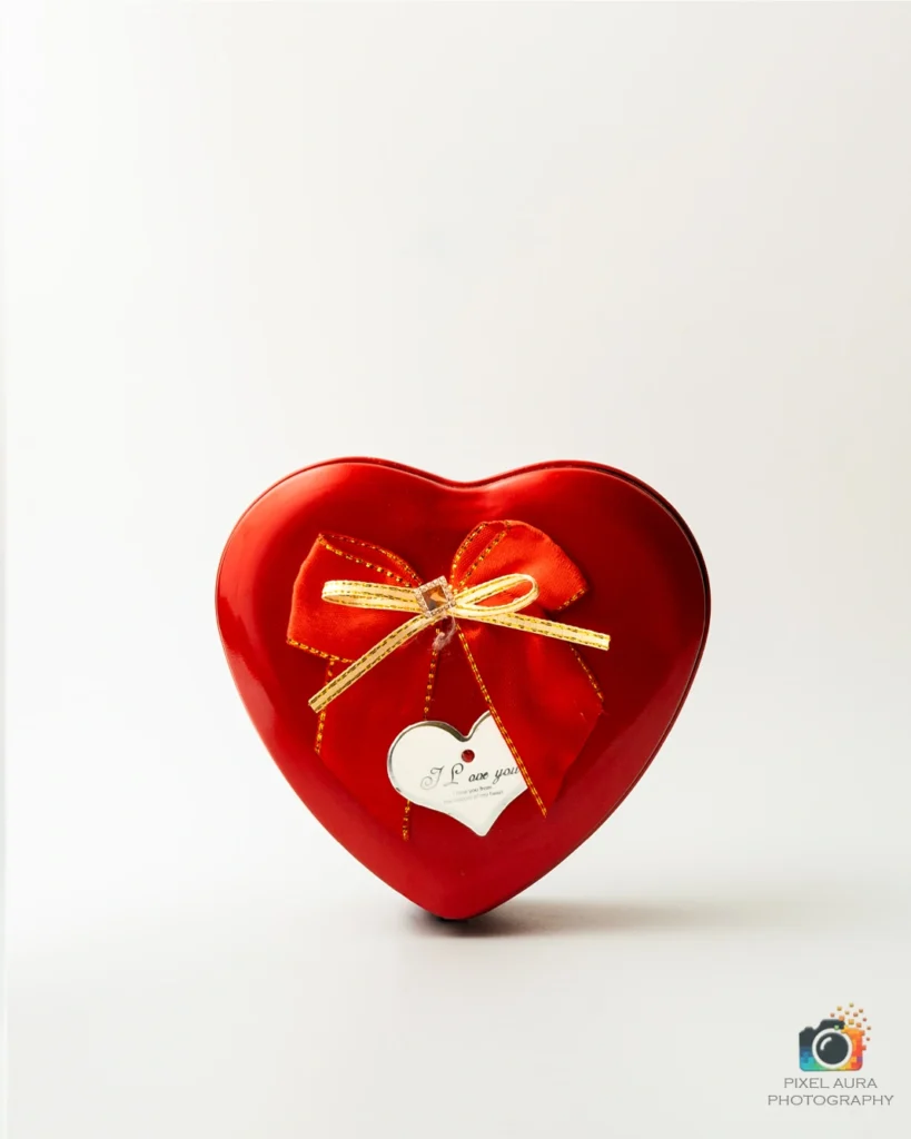 Red heart-shaped gift box photographed for product advertising