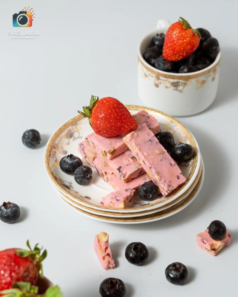 Strawberry dessert photographed with fresh berries