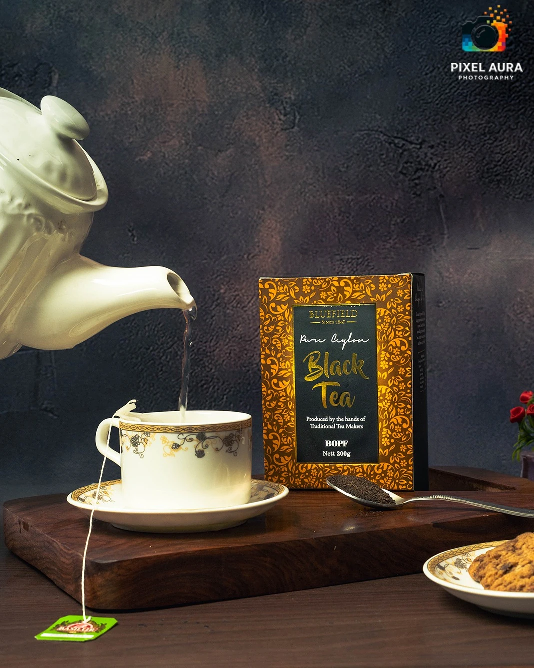 Black tea being poured into a cup